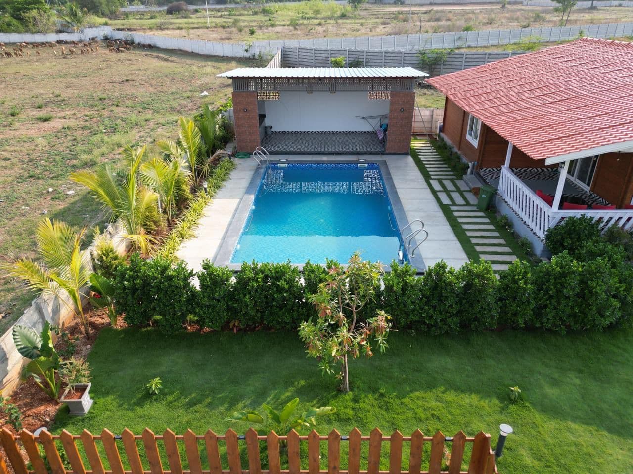 Kuku Farmstay garden and pool